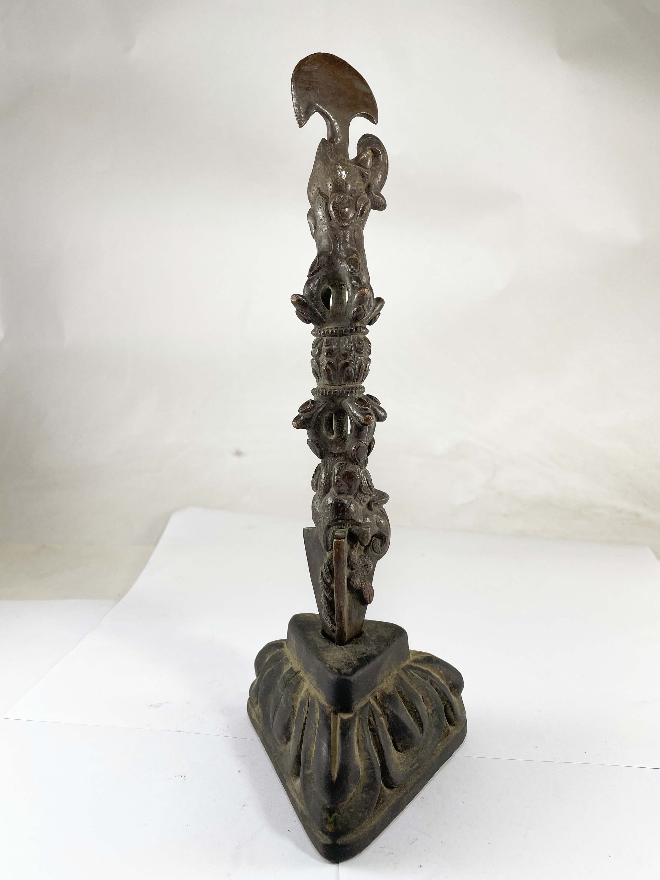 Phurba With Chocolate Oxidized On Wooden Base With dorje At Middle And Dragon On Top And Bottom